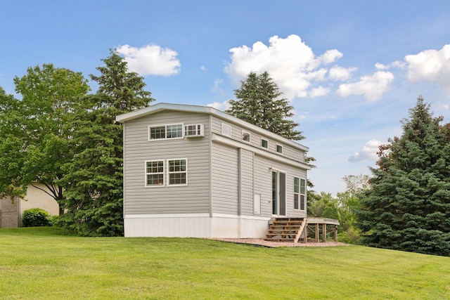 13380 Willandale Rd, Rogers, MN 55374 - view of side of property with a lawn and an AC wall unit