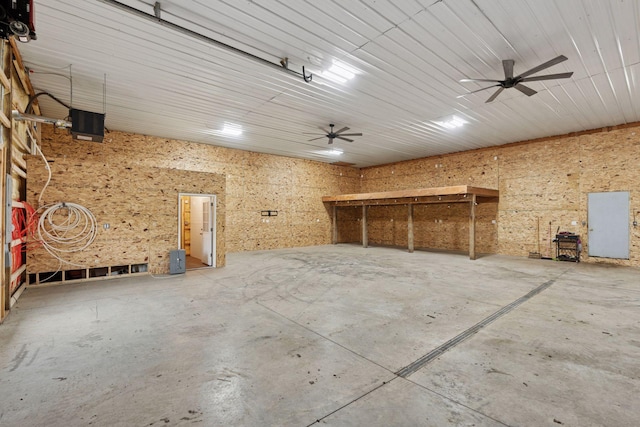 13380 Willandale Rd, Rogers, MN 55374 - miscellaneous room featuring a garage, concrete flooring, and a workshop area