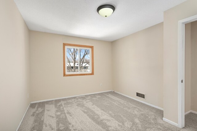 16860 Grenadier Ave, Lakeville, MN 55044 - carpeted spare room featuring baseboards, visible vents, and a textured ceiling