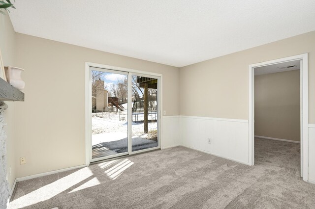 16860 Grenadier Ave, Lakeville, MN 55044 - carpeted spare room featuring wainscoting and visible vents
