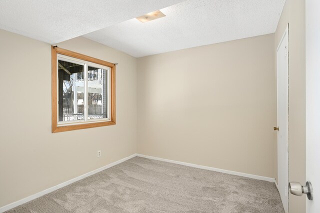16860 Grenadier Ave, Lakeville, MN 55044 - spare room featuring light carpet, baseboards, and a textured ceiling