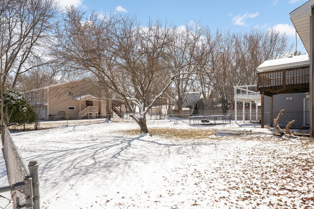 16860 Grenadier Ave, Lakeville, MN 55044 - snowy yard featuring a trampoline and fence