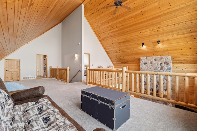 additional living space with carpet, visible vents, a ceiling fan, wood ceiling, and high vaulted ceiling