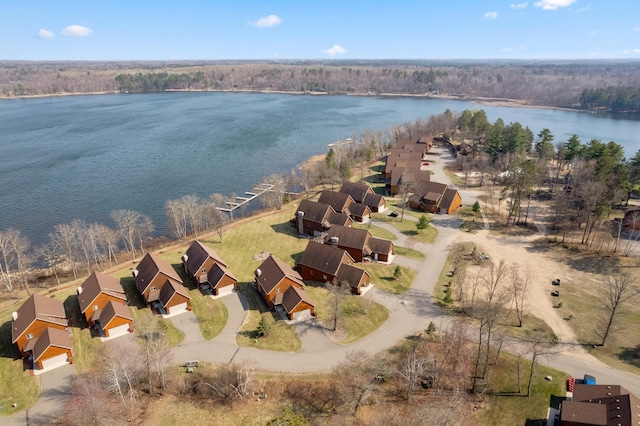 drone / aerial view featuring a residential view and a water view