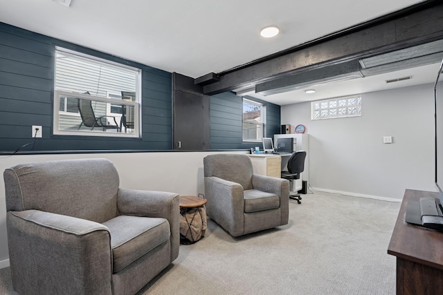 interior space with beamed ceiling, carpet, visible vents, and baseboards