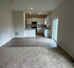 unfurnished living room featuring recessed lighting, visible vents, and baseboards