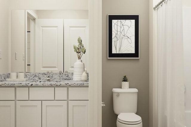 bathroom with toilet and vanity