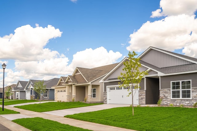 craftsman inspired home featuring a garage, a shingled roof, a front lawn, and board and batten siding