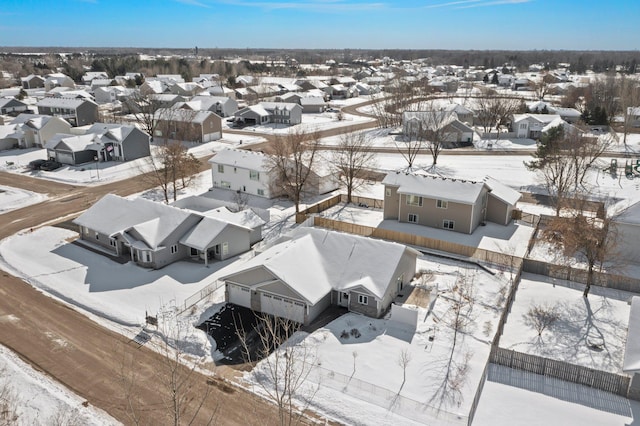 snowy aerial view featuring a residential view