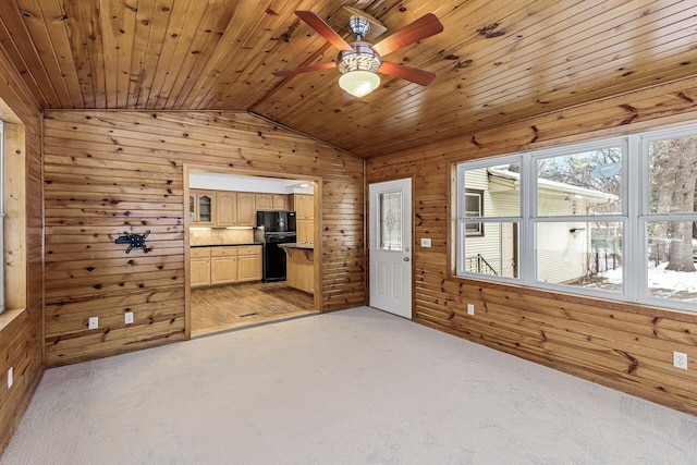 interior space with wooden ceiling, wood walls, vaulted ceiling, and light colored carpet