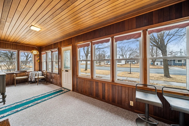 unfurnished sunroom featuring wooden ceiling