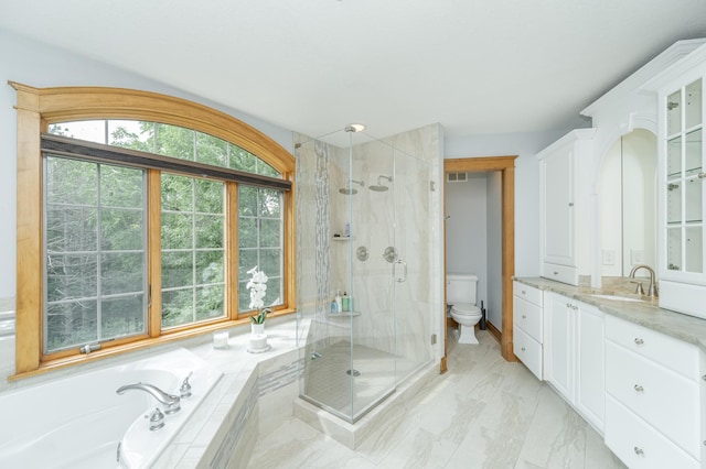 bathroom featuring visible vents, marble finish floor, a stall shower, and a bath