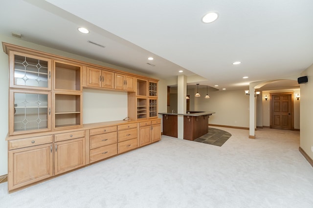 interior space with light carpet, baseboards, arched walkways, and recessed lighting