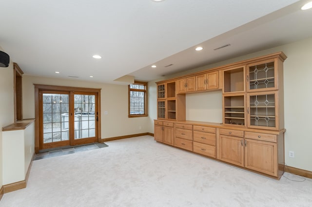 interior space featuring light carpet, recessed lighting, baseboards, and french doors