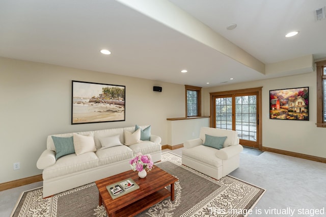 living room featuring recessed lighting and baseboards