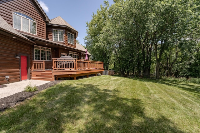 view of yard with a wooden deck