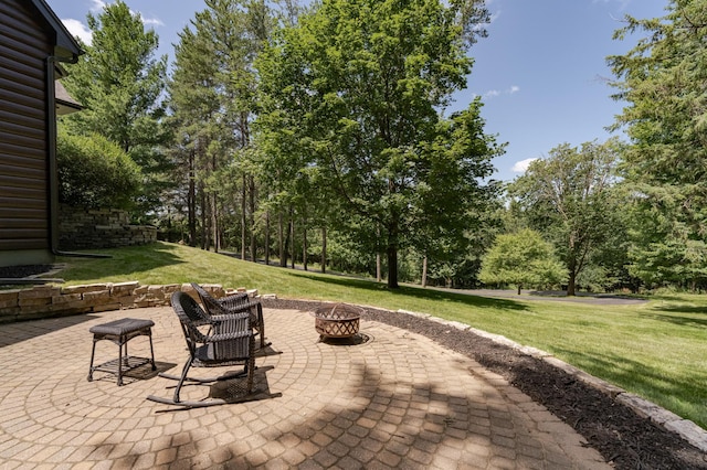 view of patio with an outdoor fire pit