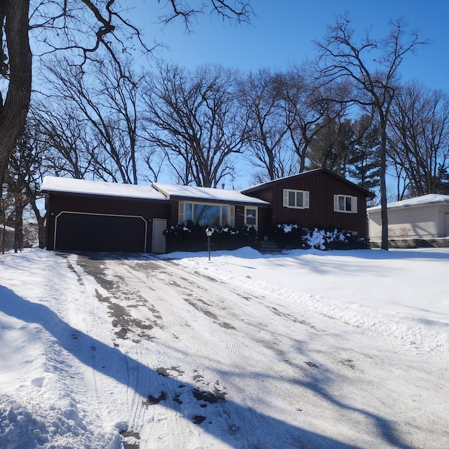 view of front of property with a garage and board and batten siding