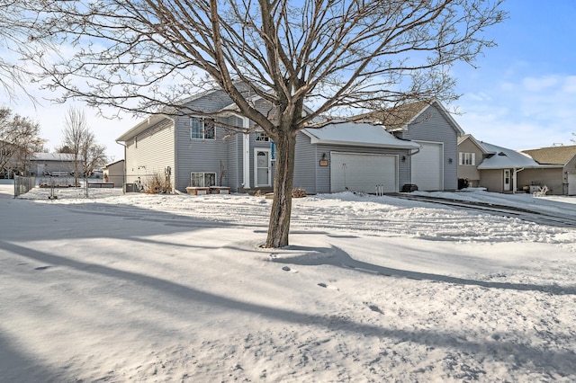 view of front of house featuring an attached garage and a residential view