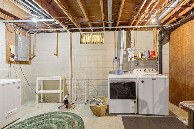 laundry room featuring laundry area, electric panel, and independent washer and dryer