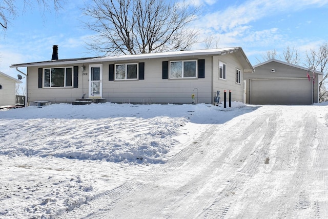 ranch-style house featuring a detached garage