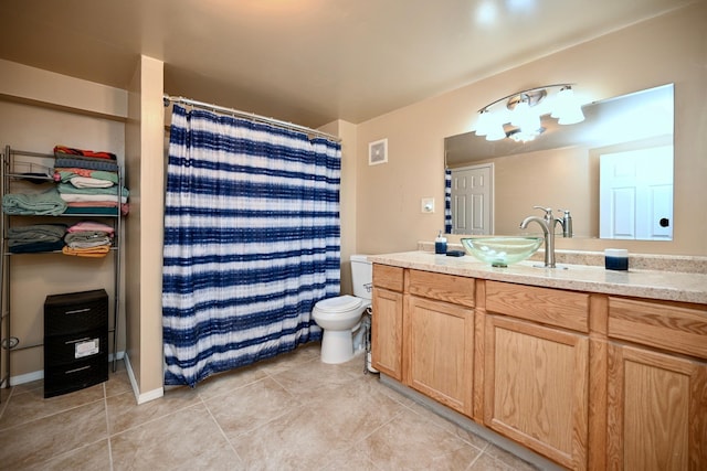 bathroom with curtained shower, visible vents, toilet, vanity, and tile patterned flooring