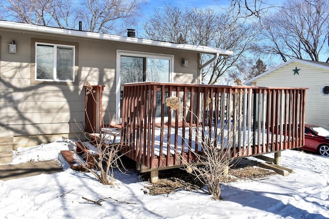 view of snow covered deck