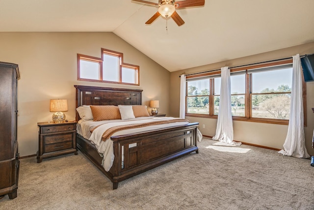 bedroom with light carpet, ceiling fan, lofted ceiling, and baseboards