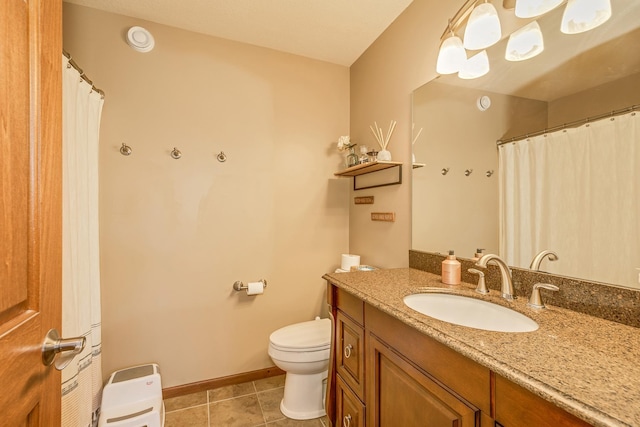 full bathroom with tile patterned flooring, vanity, toilet, and baseboards