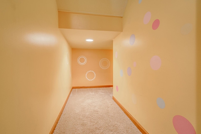 hall with carpet and baseboards