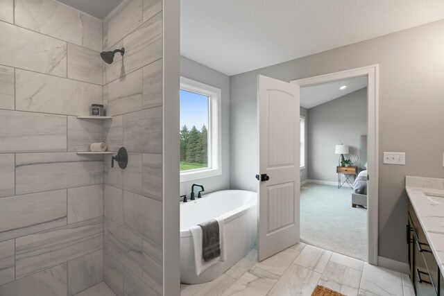 3047X Nicholas St, Grand Rapids, MN 55744 - full bathroom featuring a freestanding tub, connected bathroom, vanity, baseboards, and marble finish floor