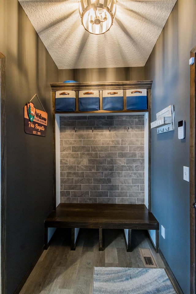 mudroom featuring visible vents and wood finished floors