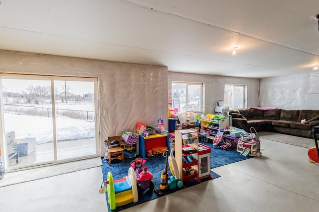 game room featuring finished concrete flooring