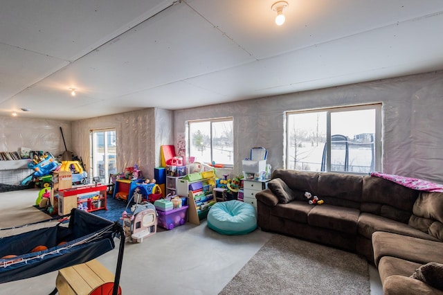 living area featuring concrete flooring