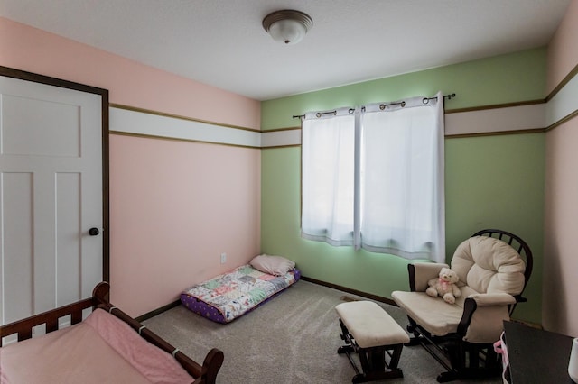 bedroom featuring carpet floors and baseboards