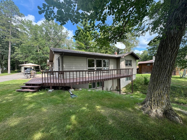 14070 County 18, Park Rapids, MN 56470 - view of front of property with a wooden deck and a front lawn