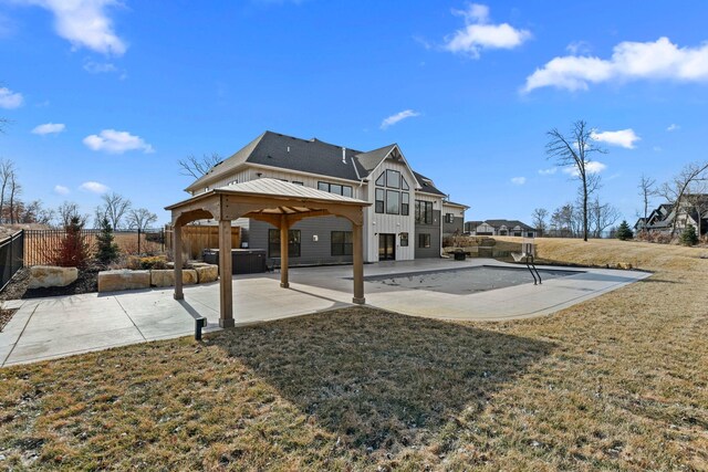19986 Unity St NW, Oak Grove, MN 55011 - back of property with board and batten siding, a gazebo, a fenced backyard, and a patio area