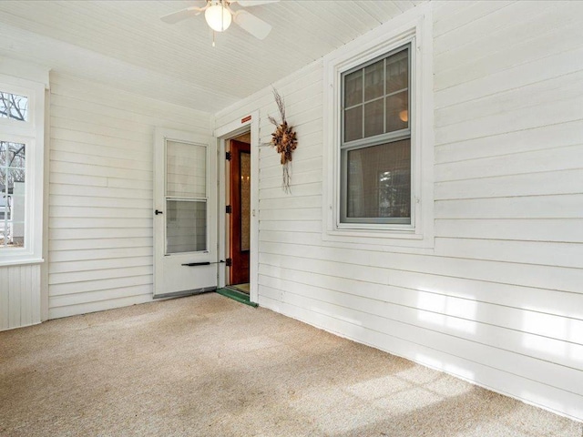 entrance to property featuring a ceiling fan