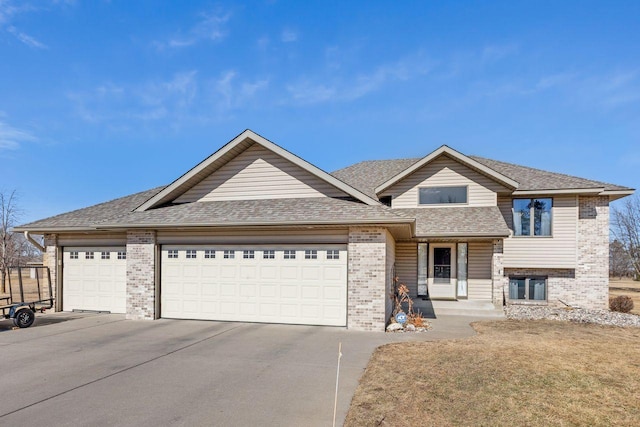 view of front of property with driveway, roof with shingles, a garage, and brick siding