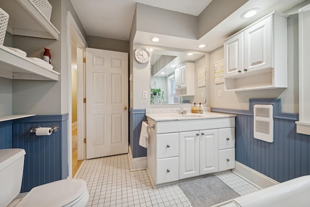 1001 Humboldt Ave W, Saint Paul, MN 55118 - bathroom with vanity, a wainscoted wall, and toilet