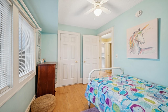 1001 Humboldt Ave W, Saint Paul, MN 55118 - bedroom featuring multiple windows, a ceiling fan, and light wood-type flooring