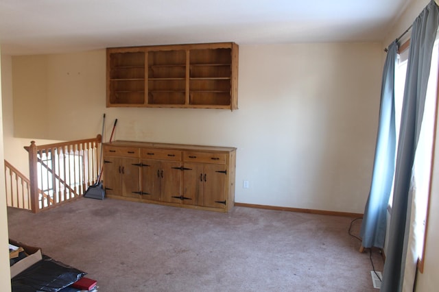 empty room with light carpet and baseboards