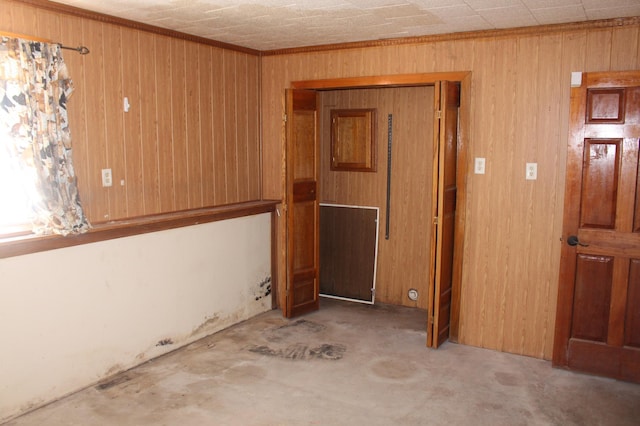 empty room featuring wooden walls