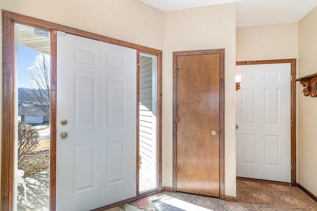 entrance foyer featuring baseboards