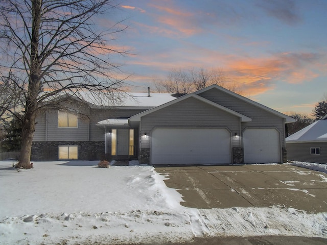 view of front of property featuring driveway and an attached garage