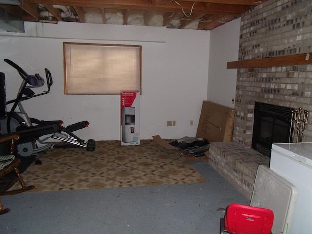 exercise area featuring a fireplace