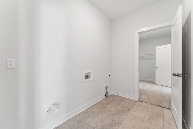 clothes washing area featuring laundry area, baseboards, hookup for a gas dryer, hookup for a washing machine, and hookup for an electric dryer