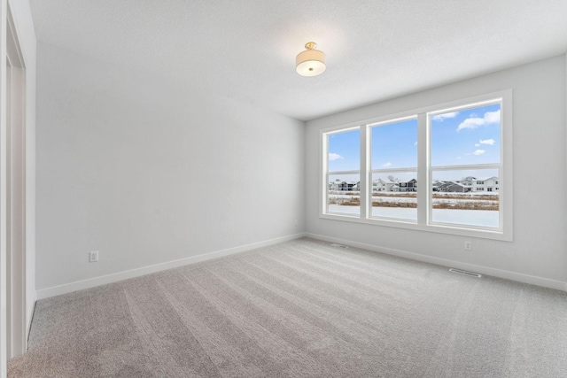 4870 127th Ln NE, Blaine, MN 55449 - carpeted empty room with baseboards