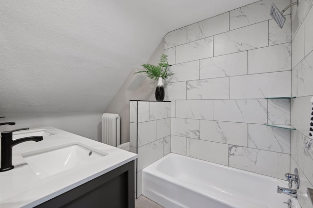 bathroom with bathing tub / shower combination, lofted ceiling, radiator heating unit, a textured ceiling, and vanity