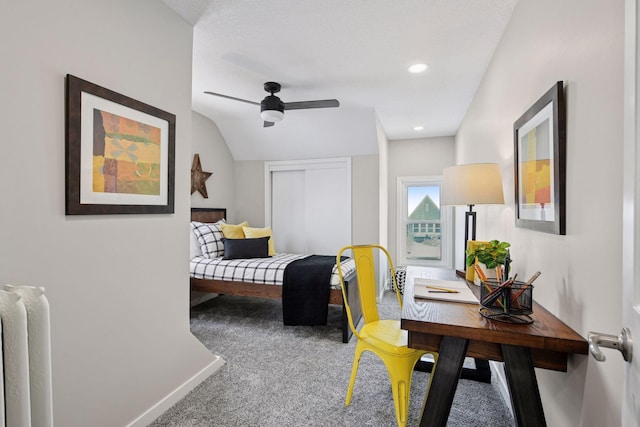 bedroom featuring lofted ceiling, a closet, carpet flooring, ceiling fan, and baseboards